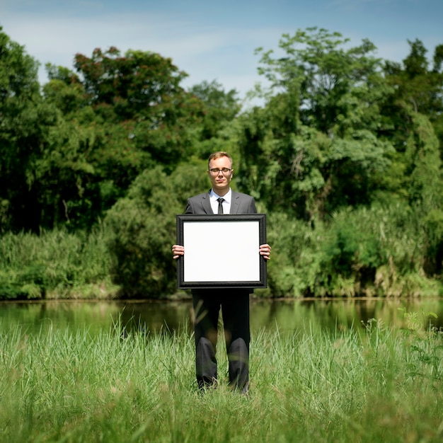 Businessman Holding Picture Frame Copy Space Concept