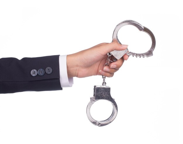 Photo businessman holding shackle isolated on white background