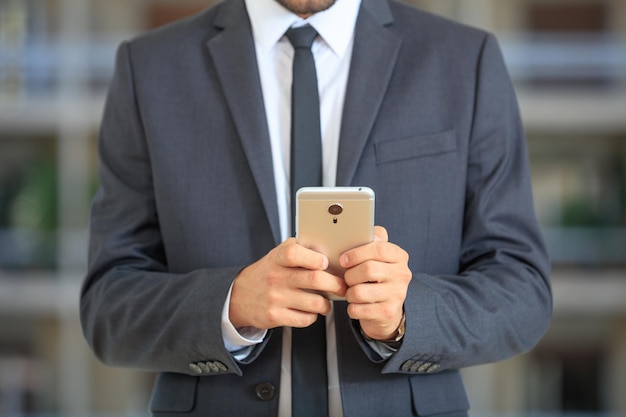 Businessman holding a smartphone