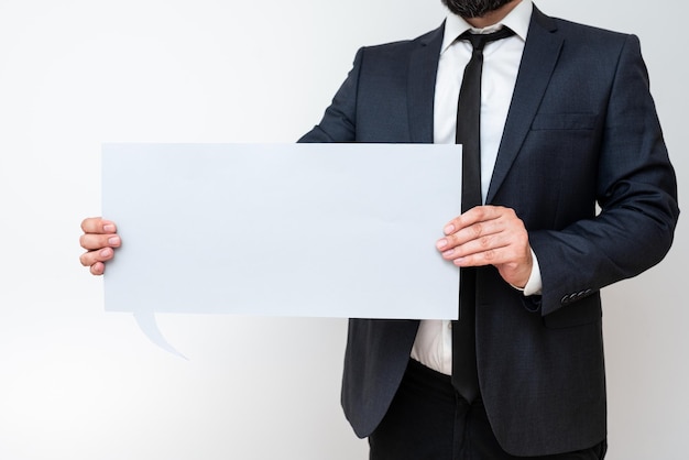 Businessman Holding Speech Bubble With Important Messages Man In Suit Presenting Crutial Informations On Dialogue Balloon Gentleman Showing Recent Updates On Paper