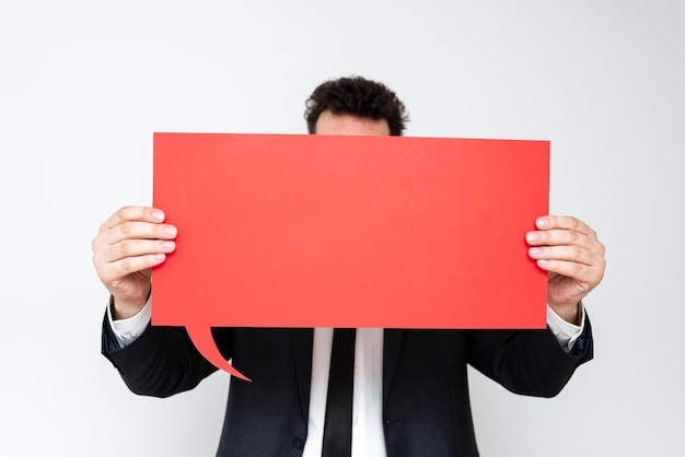 Businessman Holding Speech Bubble With Important Messages Man In Suit Presenting Crutial Informations On Dialogue Balloon Gentleman Showing Recent Updates On Paper