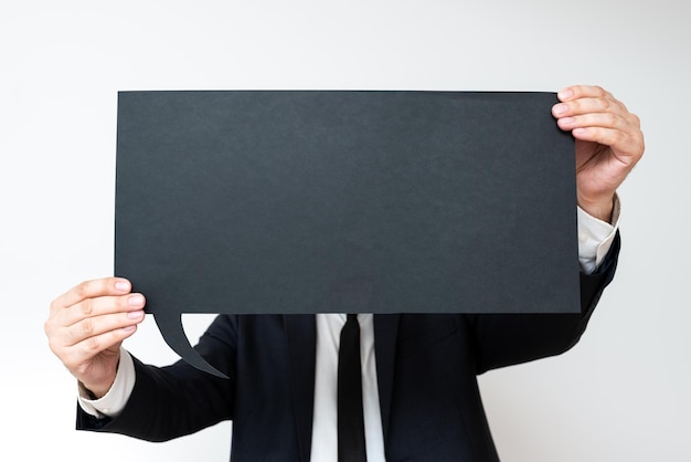 Businessman holding speech bubble with important messages man in suit presenting crutial