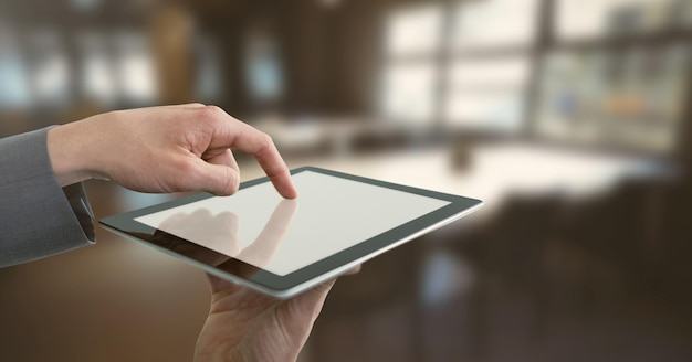 Businessman holding tablet in office