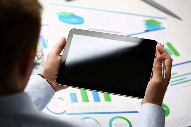 Businessman holding tablet