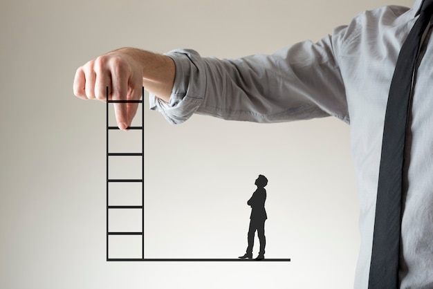 Photo businessman holding up a ladder between his fingers as a small silhouette of a second stands watching below