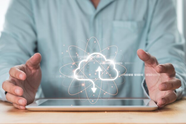 Businessman holding virtual cloud on tablet