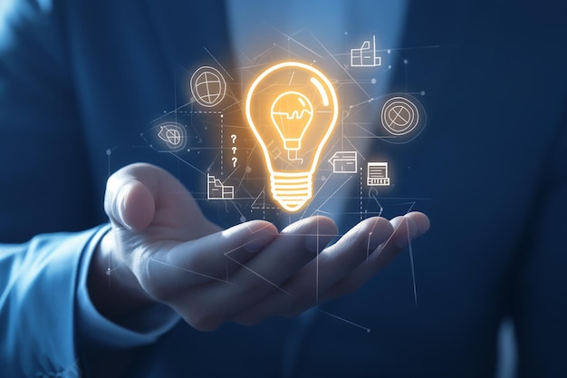 businessman holding virtual light bulb icon for motivation for success and thinking of ideas