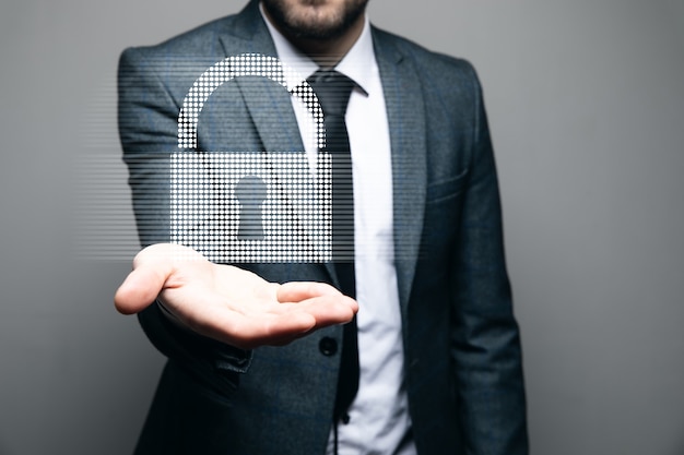 Photo businessman holding a virtual padlock