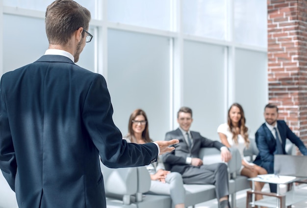 Businessman holds a briefing with the business teambusiness background