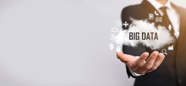 Businessman holds the inscription , word big data. padlock ,
brain ,man, planet,graph, magnifier, gears, cloud, grid, document,
letter, phone icon.