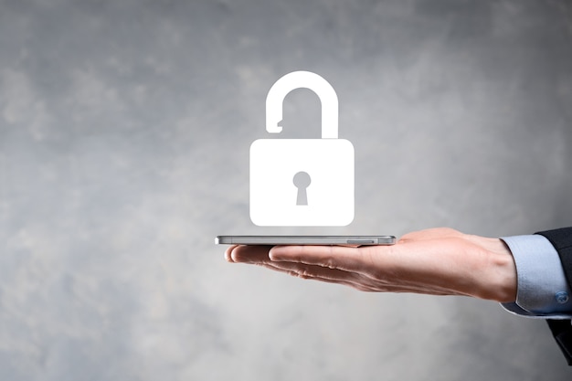 Businessman holds an open padlock icon on his palm