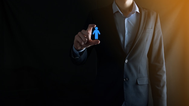 Businessman holds person icon