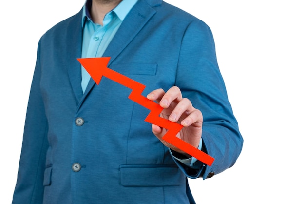Businessman holds a red arrow chart pointing up