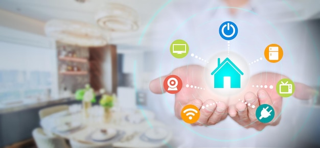 Businessman holds smart home automation program smart home concept