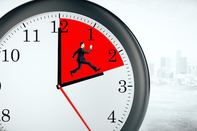 Businessman inside clock deadline concept