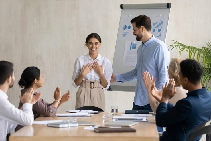 Photo businessman introduce excited ethnic female worker or employee to team at group office meeting diverse businesspeople greeting congratulating happy woman colleague with job success or promotion