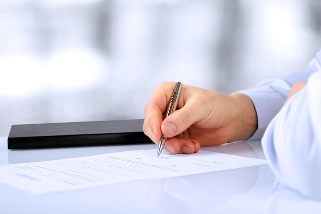 Businessman is signing a contract business contract details