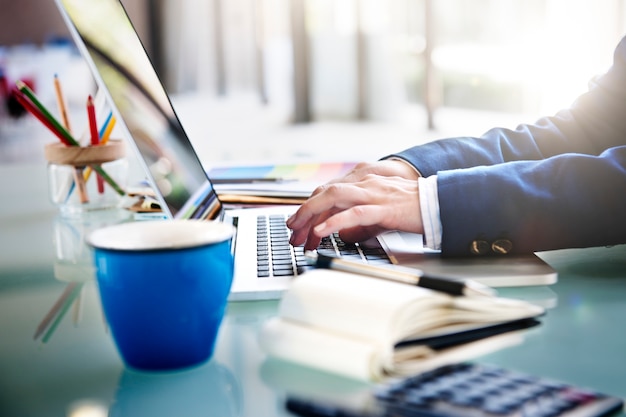 Businessman is using computer laptop