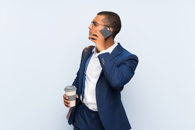 Businessman over isolated blue background