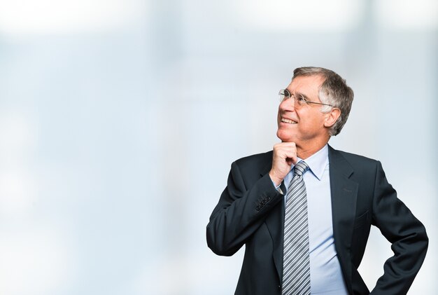 Businessman looking a bright background