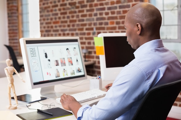 Businessman looking at computer monitor