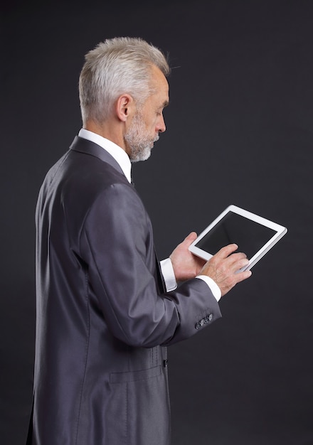 businessman looking at digital tablet screen