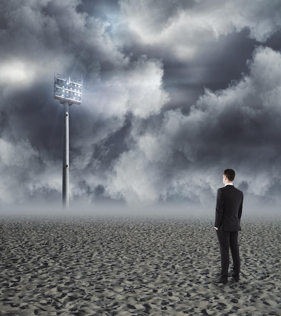 Businessman looking at lamp