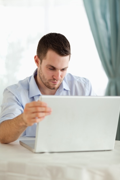 Businessman looking at laptop