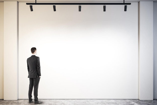 Businessman looking at poster