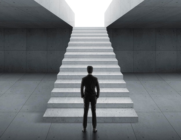 Businessman looking at stairs business start concept