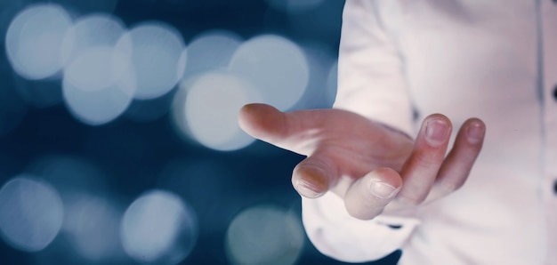 Businessman making giving and protecting gesture