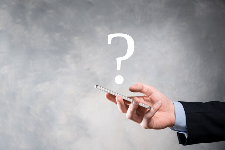 Photo businessman man hand hold interface question marks sign web. ask quiestion online, faq concept, what where when how and why, search information on internet.