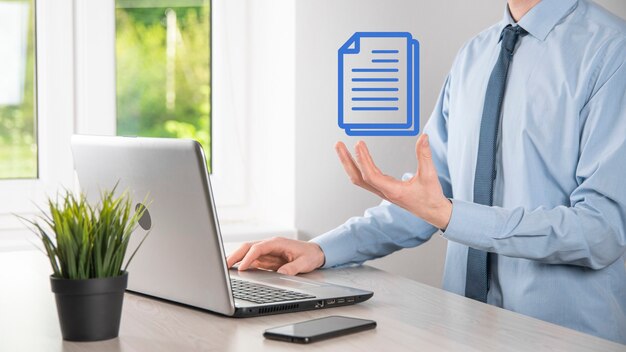 Businessman man holding a document icon in his hand Document Management Data System Business Internet Technology Concept. Corporate data management system DMS .