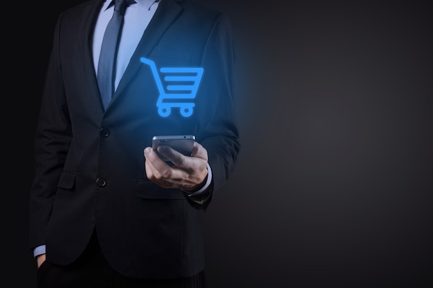 Businessman man holding shopping cart trolley mini cart in business digital payment interface