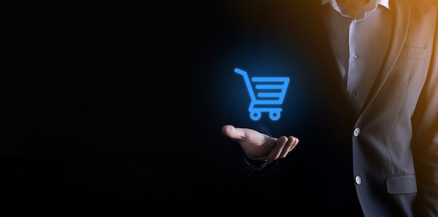 Businessman man holding shopping cart trolley mini cart in business digital payment interface.