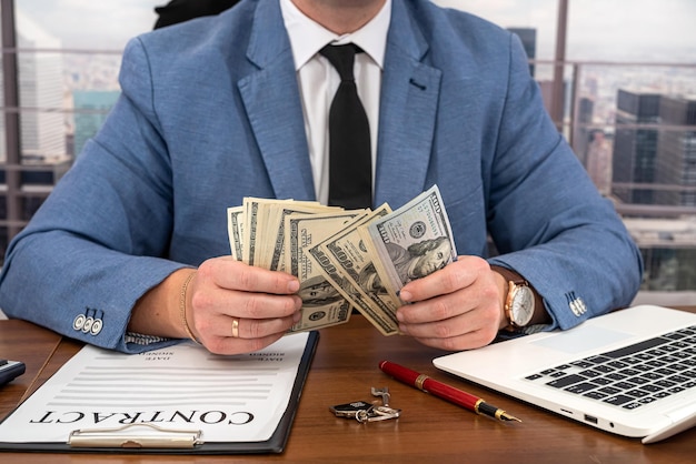 Businessman man in a stylish clean suit working on a very important work contract Money and contracts business concept