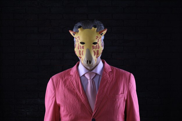 businessman in a mask of a giraffe