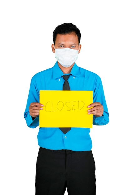 Businessman in mask and showing Closed text