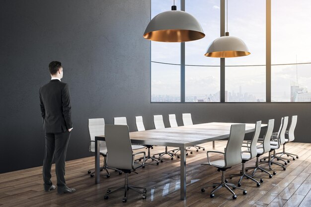 Businessman in minimalistic conference room