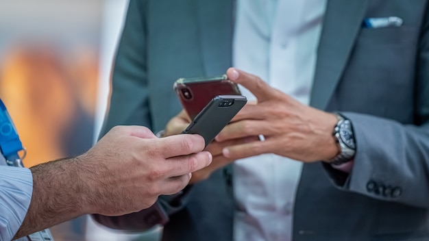 Businessman And Mobile Phone At Trade Fair