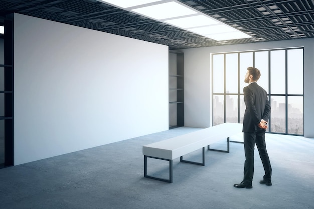 Businessman in modern gallery hall