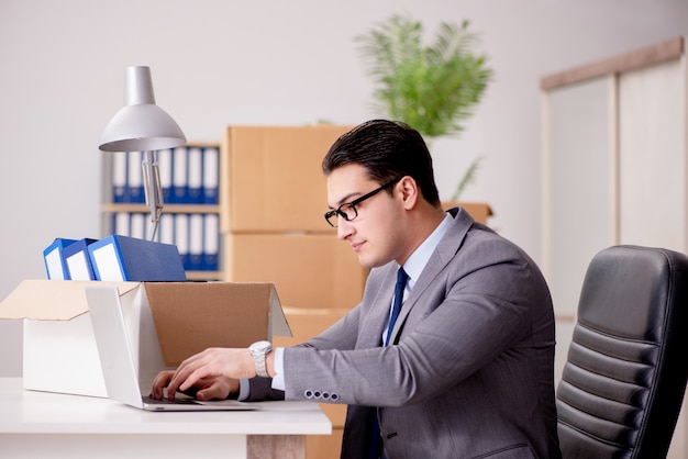 Businessman moving offices after promotion