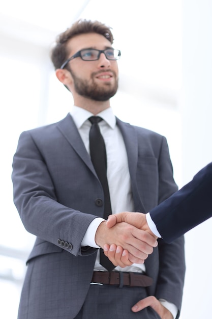 Businessman Offering Handshake in meeting room Success Concept