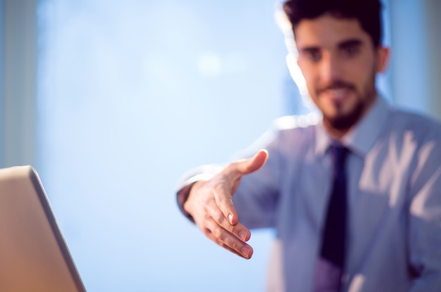 Businessman offering to shake hands