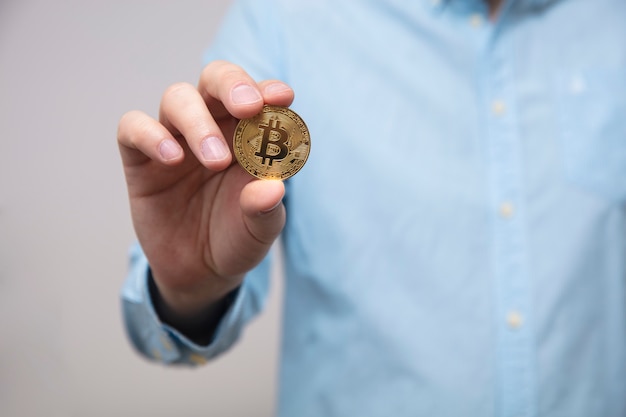 Businessman offers bitcoin in the hand