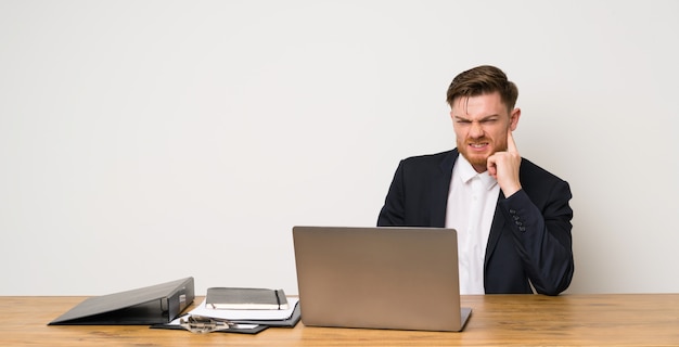 Businessman in a office having doubts