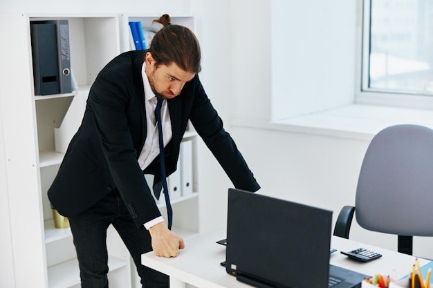 Photo businessman in the office with documents executive