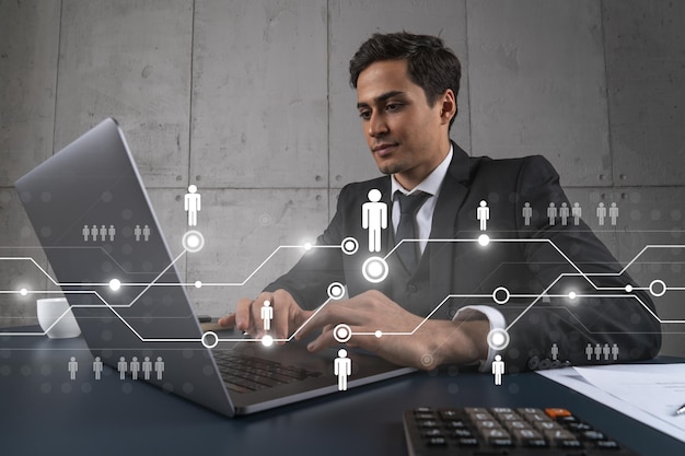 Photo businessman in office working with laptop develop networking chain to push new social media project typing computer double exposure