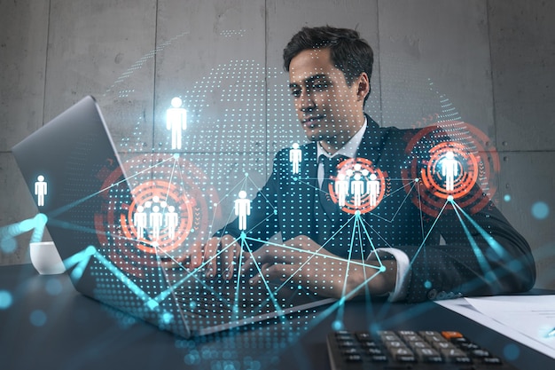 Businessman in office working with laptop develop networking chain to push new social media project typing computer Double exposure