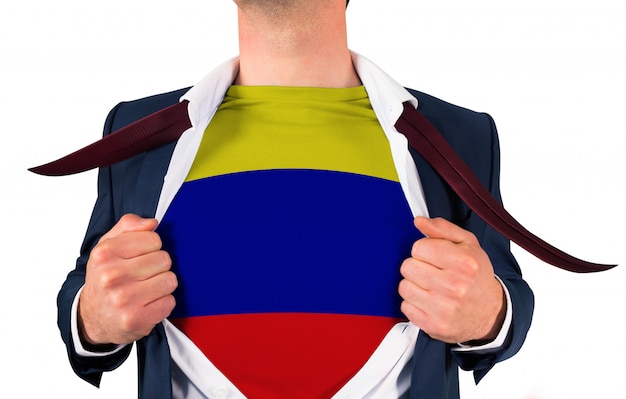 Businessman opening shirt to reveal colombia flag